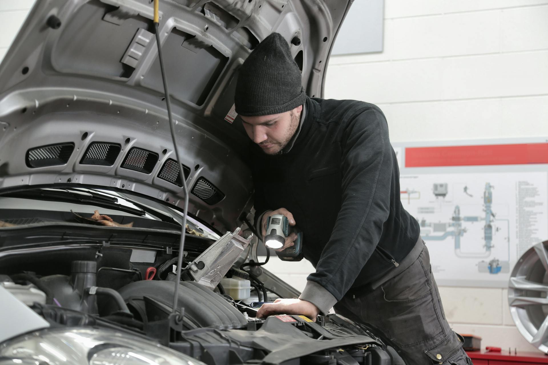 Mechanic performing scheduled maintenance at Pro Automotive Repair in Sachse TX