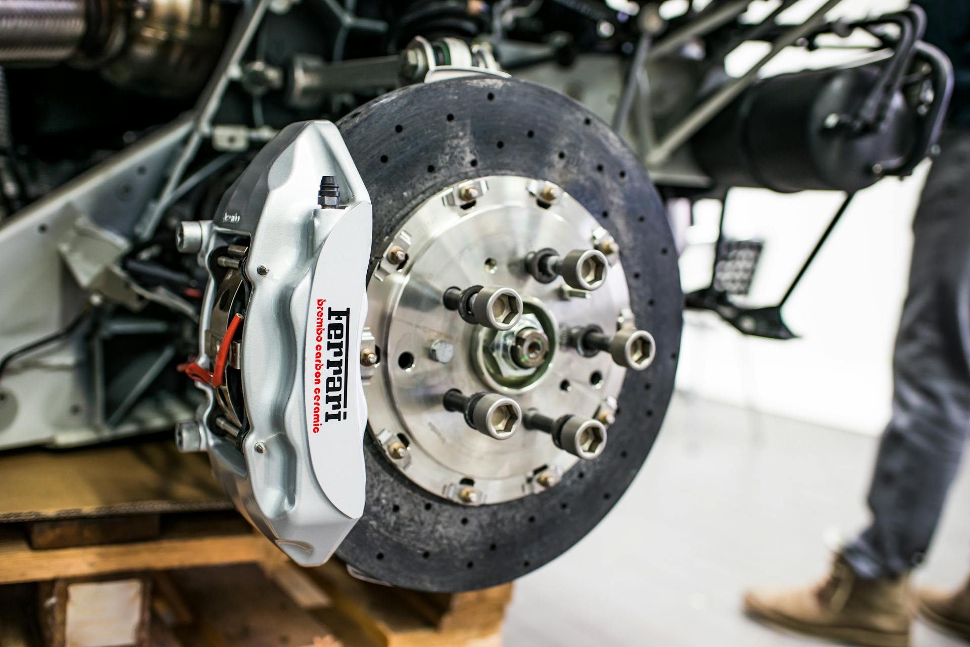 Brake caliper and rotor assembly showing brake system components